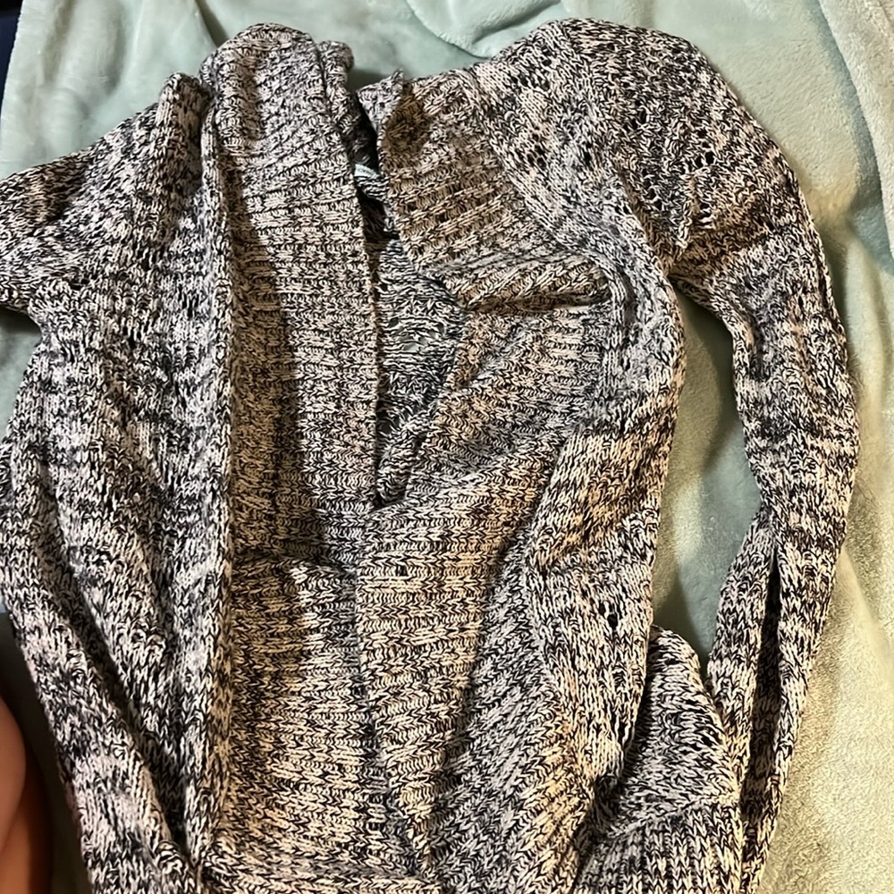 Maurice’s black and white knitted sweater